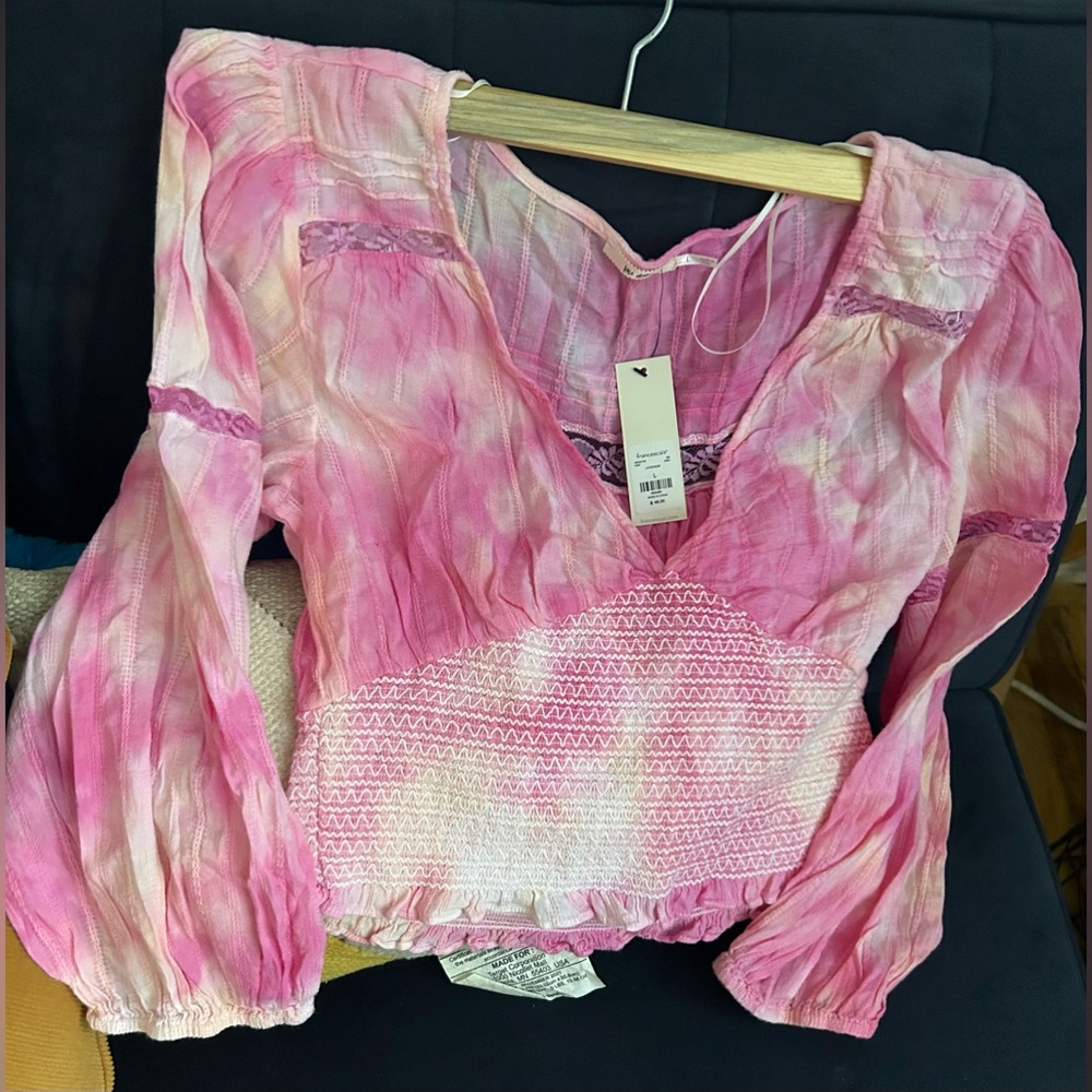 A long sleeve pink blouse